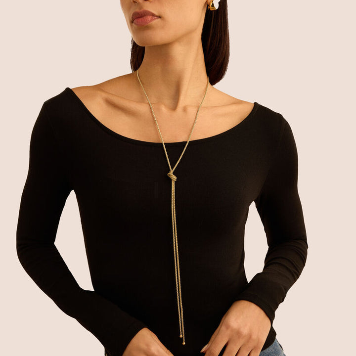 Orecchini Radiance in acciaio dorato con chiusura a clip