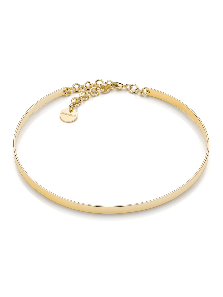 Collana rigida in bronzo con catena regolabile sul retro.