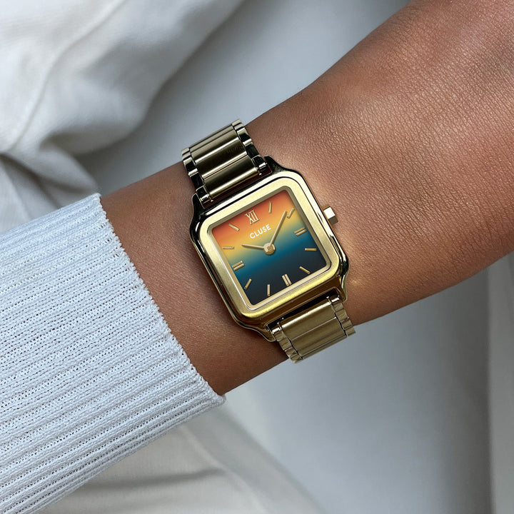 Orologio Donna Quadrato Dorato con Quadrante Tramonto Blu e Arancio in Acciaio